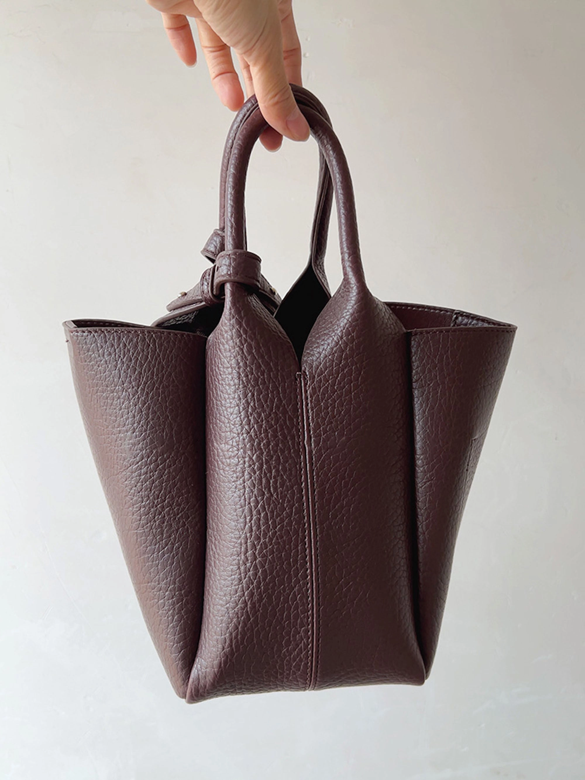 Elena Handbags Chic Leather Bucket Bag Effortless Style Compact Lifestyle