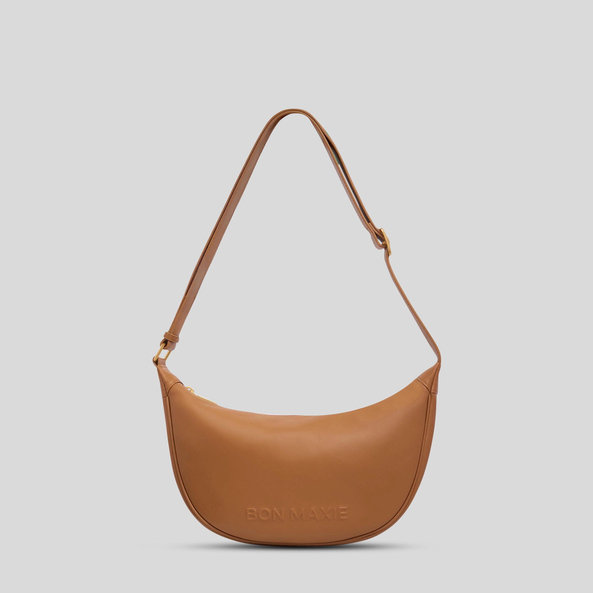 Perfect for those who need an organized and easy-to-carry bag Slouchy Crescent Bag in smooth nappa leather -- Tan