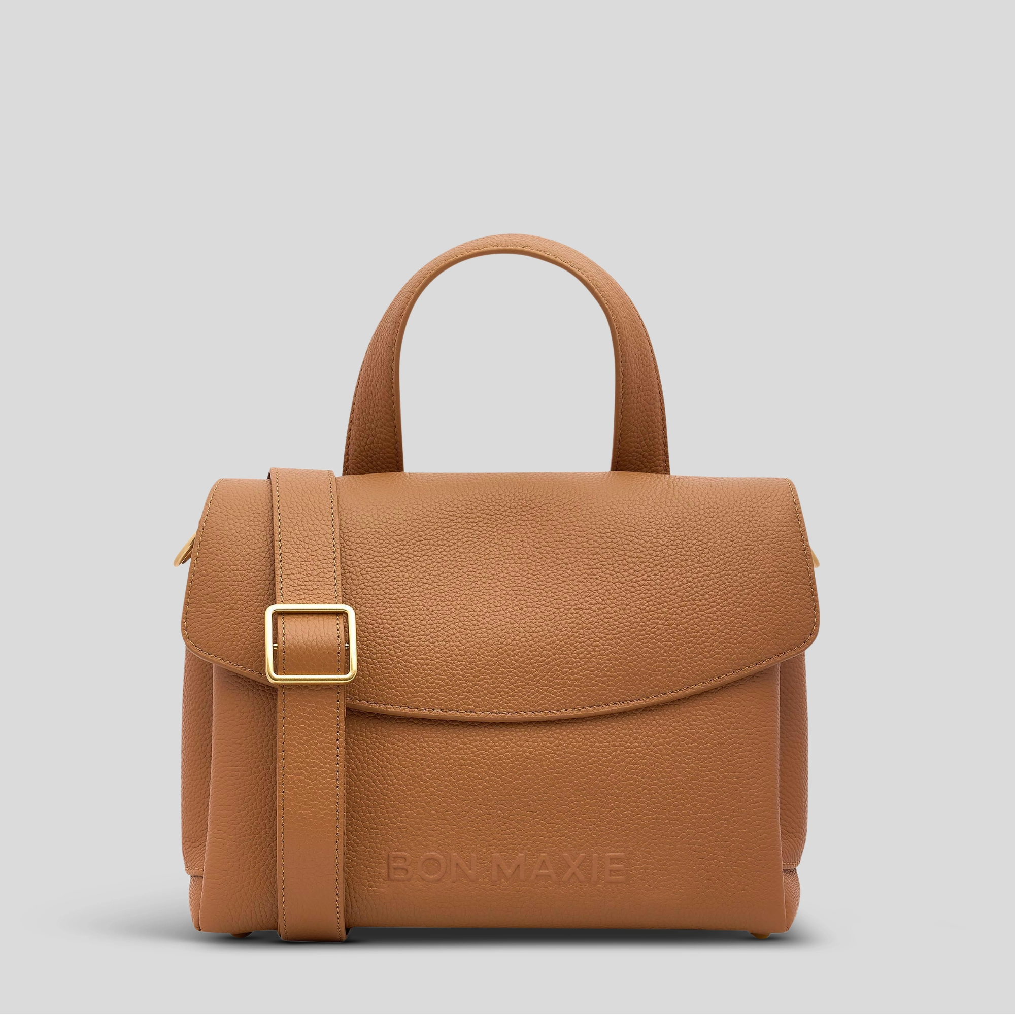 Functional compartments to keep your belongings neat and organized Elegant fashion choice Tryhard Crossbody Bag in full-grain pebbled leather -- Tan